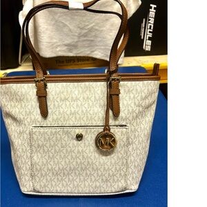 NWOT…Michael Kors medium tote with monogram white and brown bag